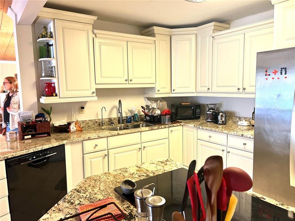 Kitchen has custom cabinets and granite countertops