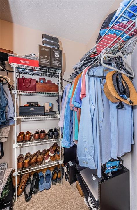 Primary His and Hers Walk-In Closet