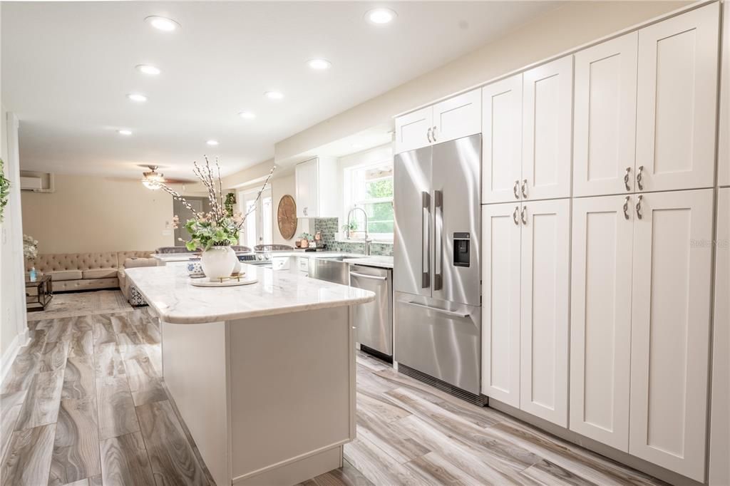 The kitchen features upgraded cabinetry throughout.