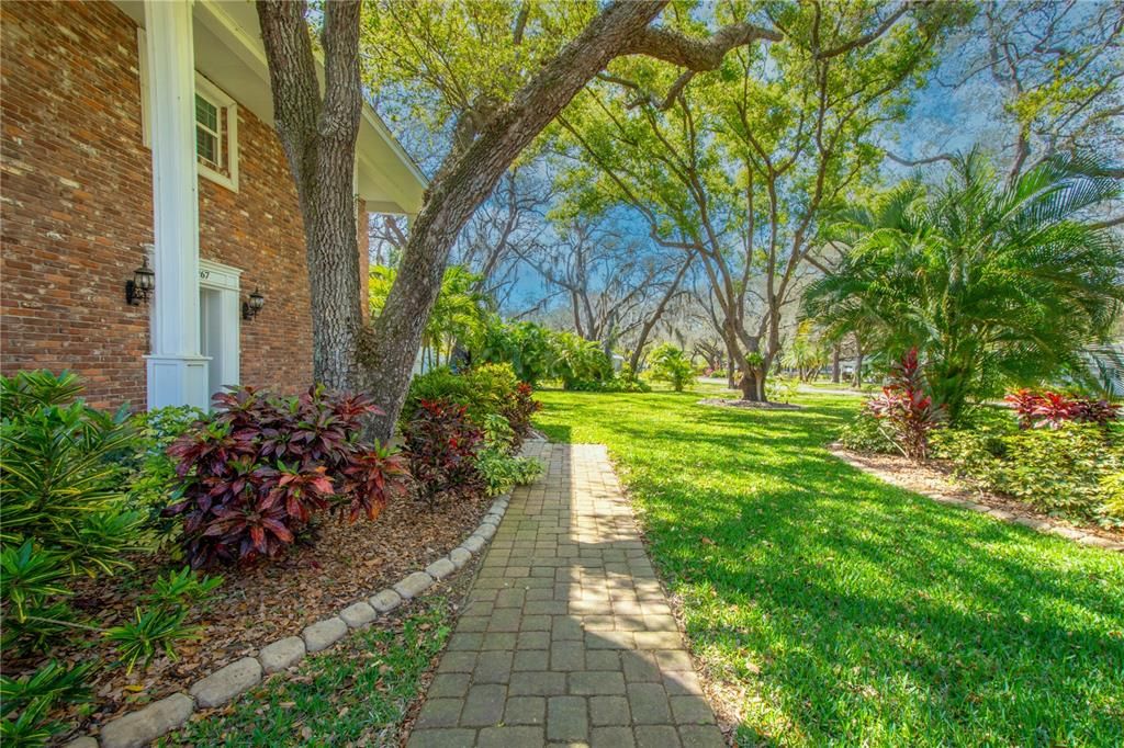 Pavered walkway makes an elegant statement leading to the front door.