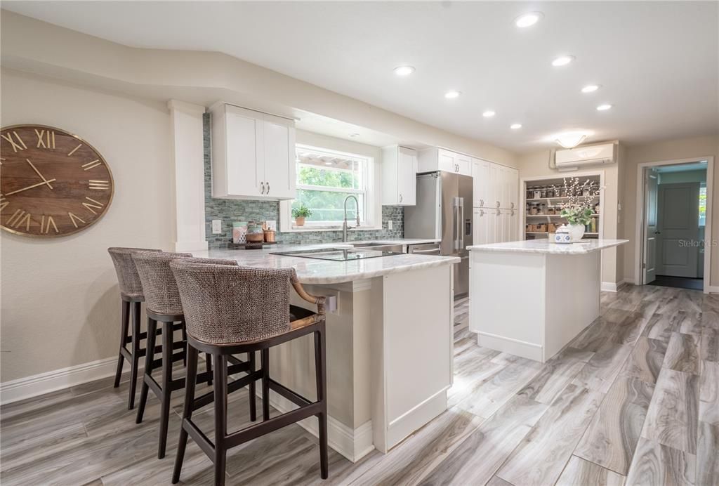 The kitchen has a window above the sink for views of the picturesque backyard.