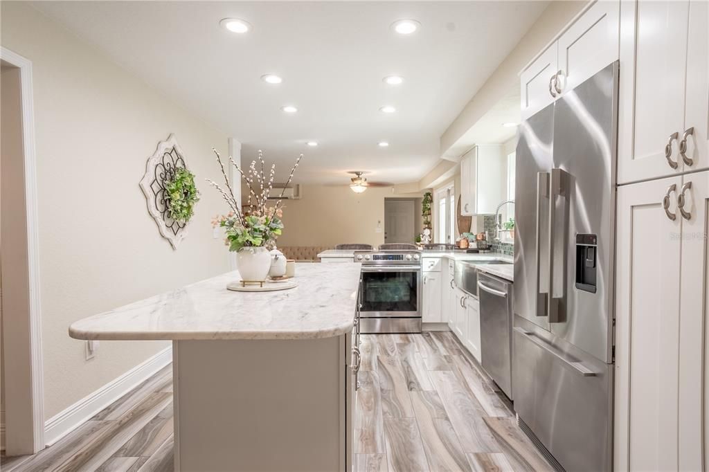 Recessed lighting illuminates the kitchen.