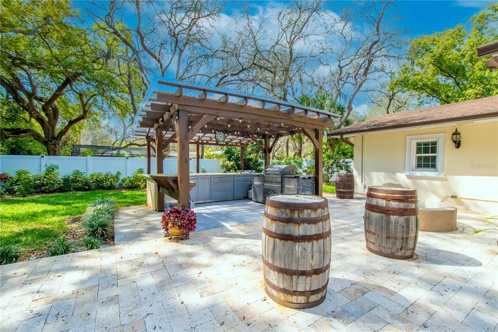 A summer kitchen provides for year round al fresco dining.