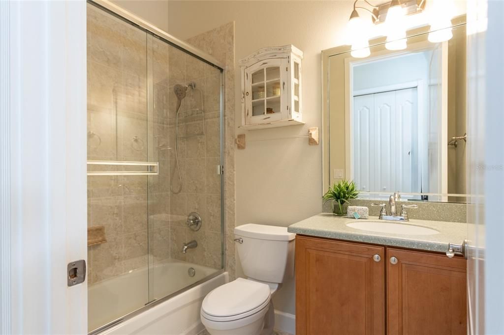 Guest Bathroom With Tub And Shower Door