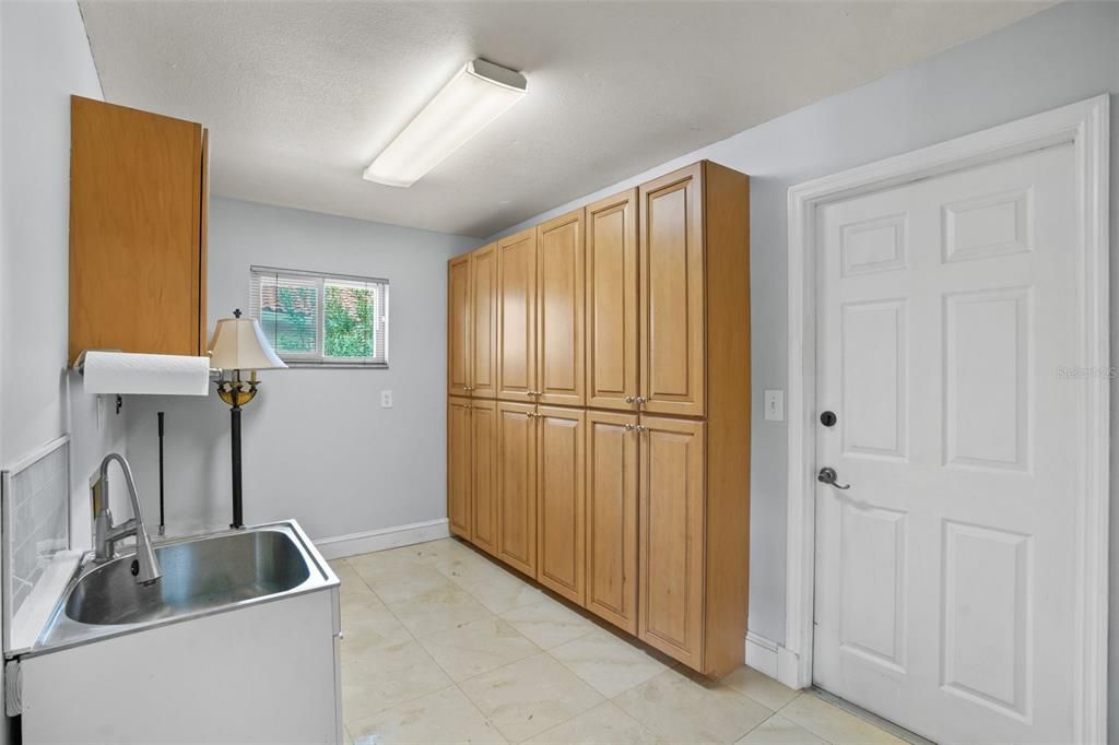 Large laundry room - great for storing shoes/bags upon entering through 2 car garage.