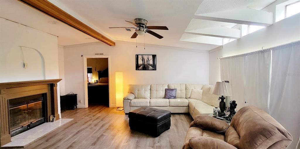 Beautiful living room area with Wood burning Fireplace