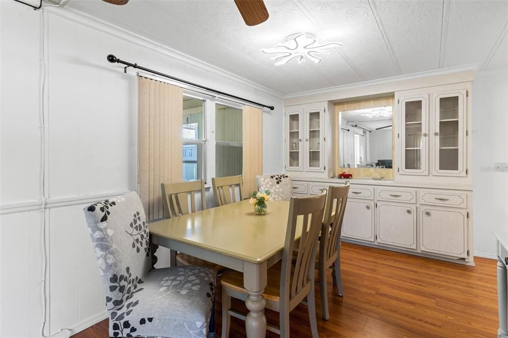 DINING AREA WITH VIEW OF FLORIDA AND BUILT IN CHINA CABINET