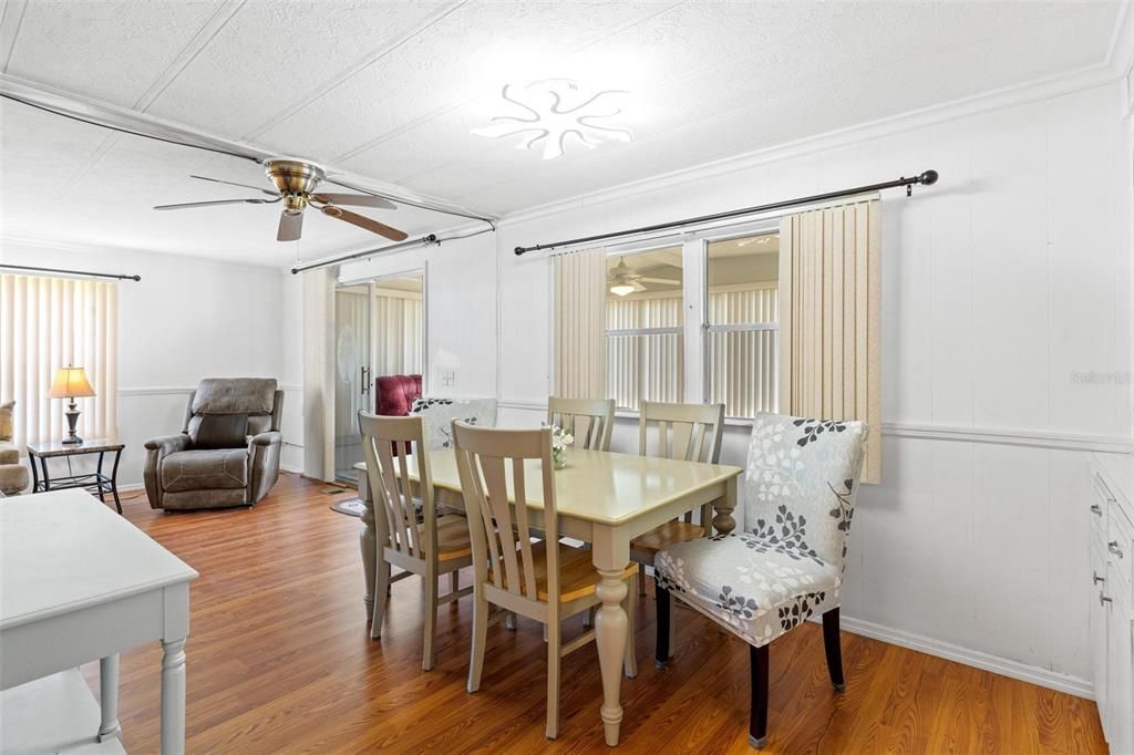 DINING AREA AND VIEW OF LIVING AREA AND FLORIDA ROOM