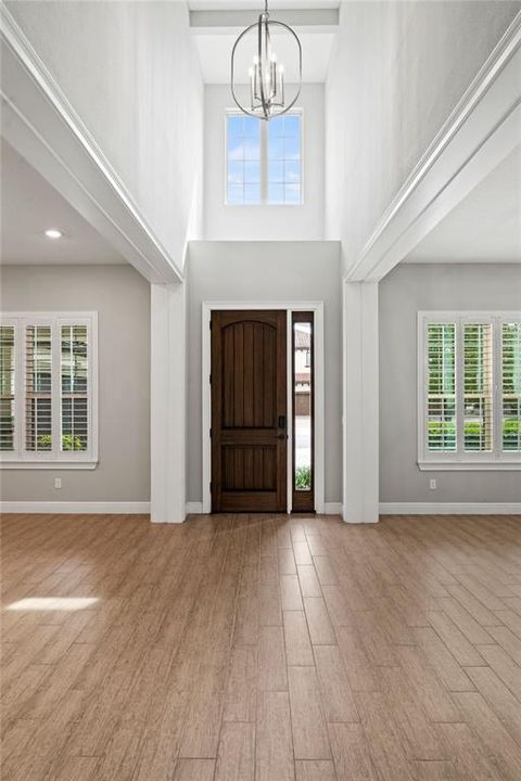 A grand foyer spanning two levels welcomes you as you enter