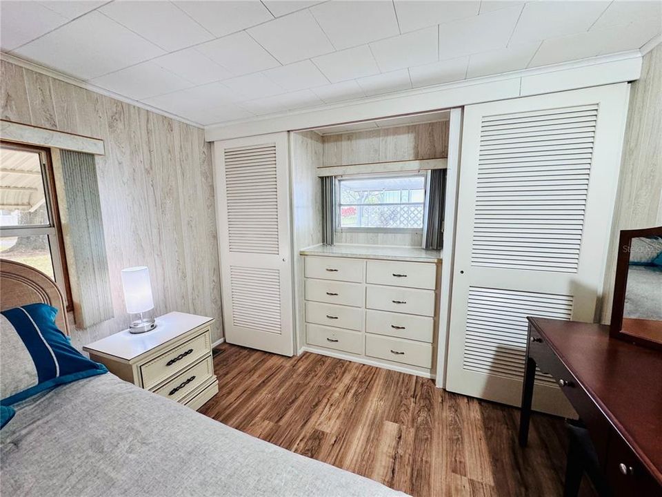 Built in dresser with three closets.