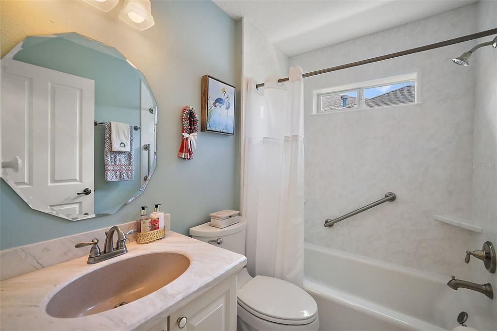 guest bath with remodeled tub and shower