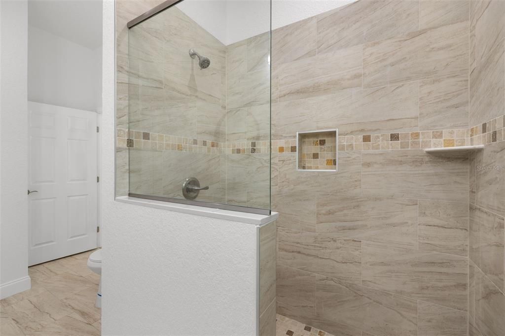 Shower w Glass Enclosure and Tiled walls