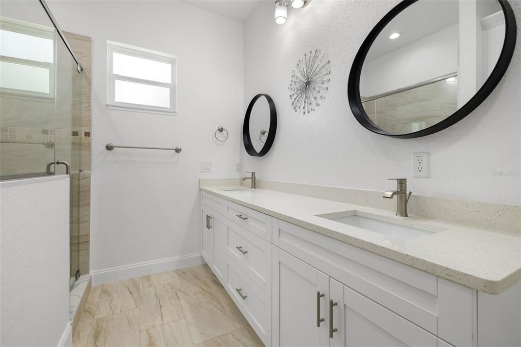 Master Bathroom-double sinks; counters with drawers, doors and Quartz top