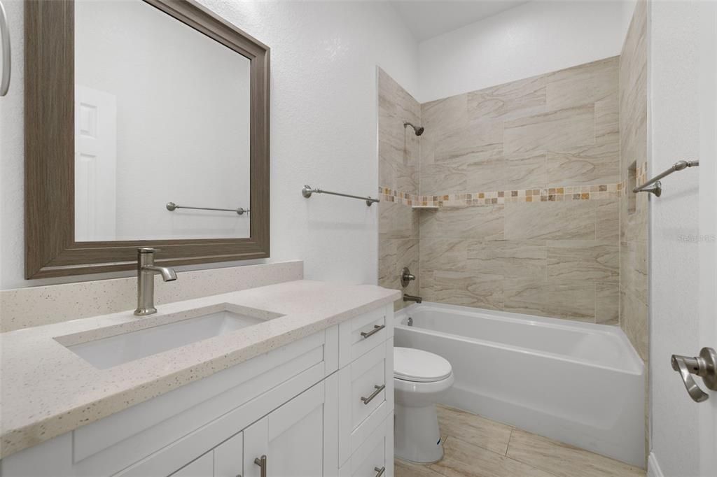 Bathroom between 2 bedrooms; Bathtub, Shower-Tiled wall