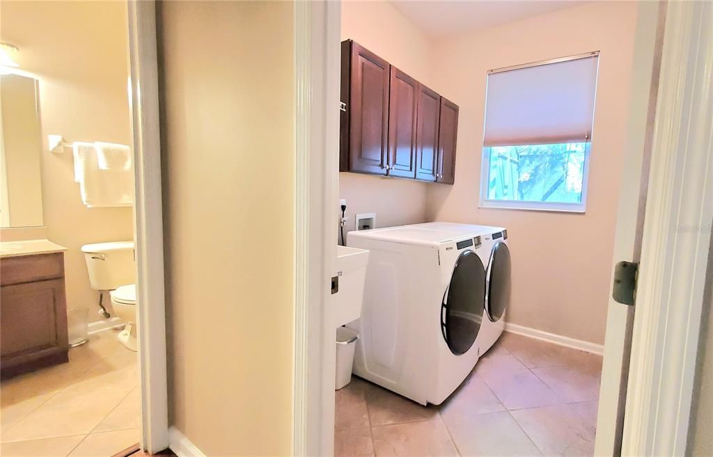 Downstairs full-size bathroom and laundry room