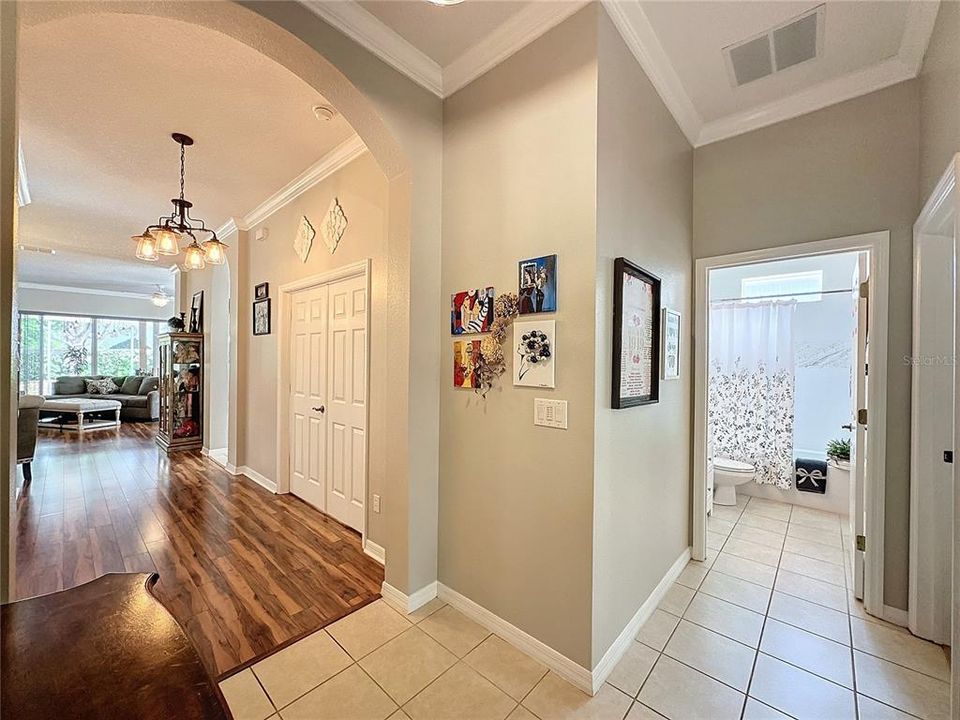 Standing in Foyer - NEUTRAL INTERIOR PAINT, NEW LUXURY VINYL FLOORING and CROWN MOLDING are a few items that complete this home