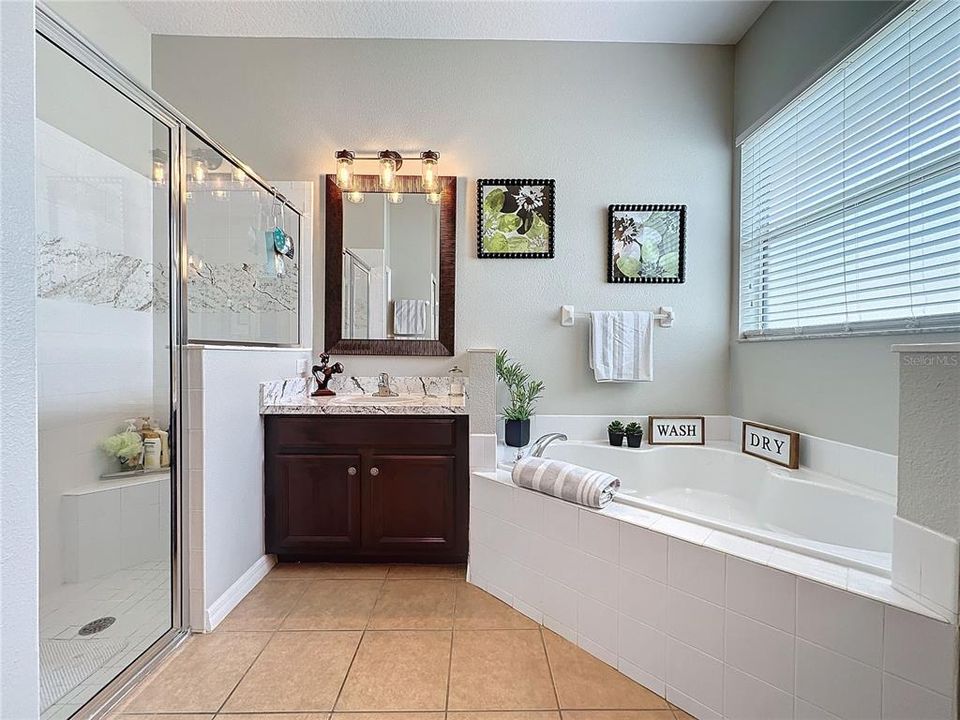 DUAL SINKS, private WATER CLOSET, GARDEN TUB, UPGRADED MIRRORS and LIGHTING.