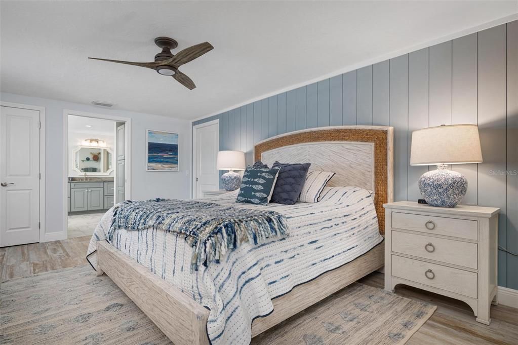 Primary bedroom with walk in closet and ensuite bath