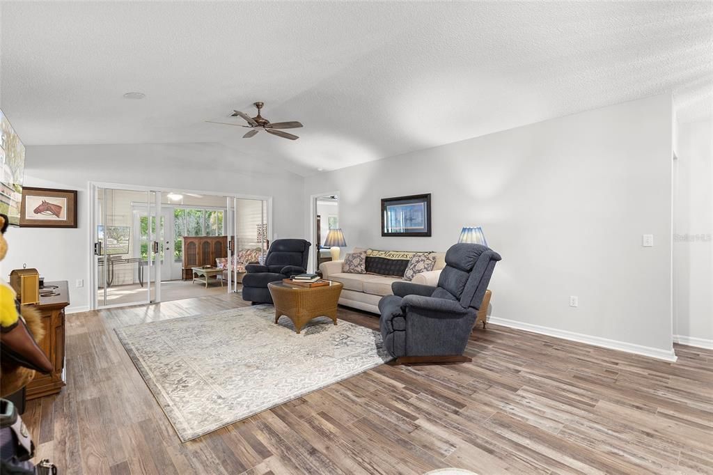 Another view of living room looking toward enclosed lanai.