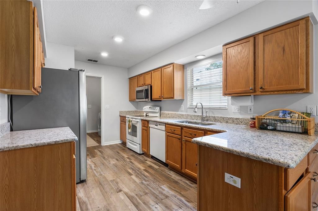 Kitchen with Granite counter tops.