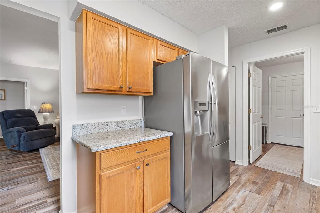 Stainless steel refrigerator and microwave.