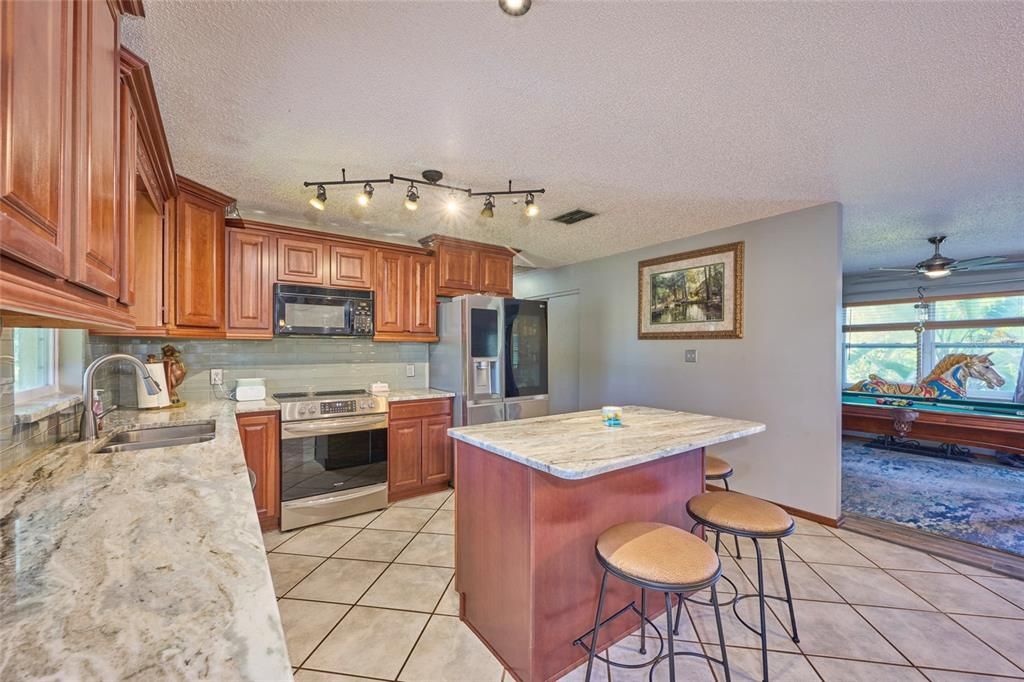 Beautiful kitchen!  Granite counter tops and stainless steel appliances