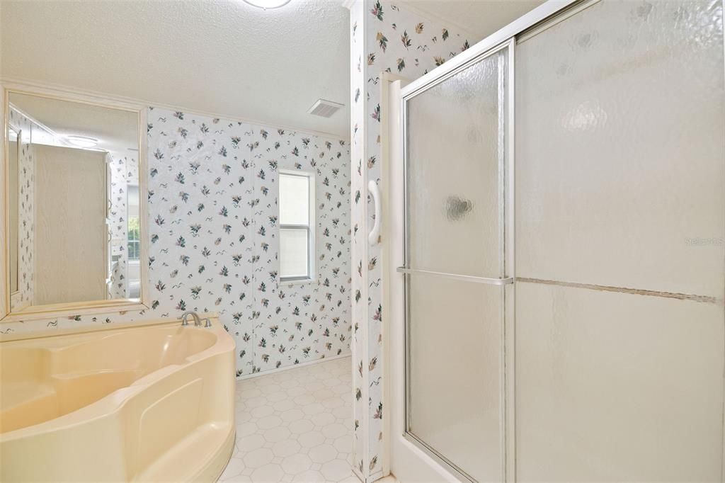 Master En-suite bath with dual sinks, garden tub, & separate shower.