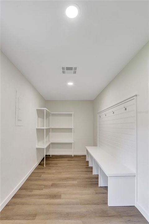 mud room with shelving