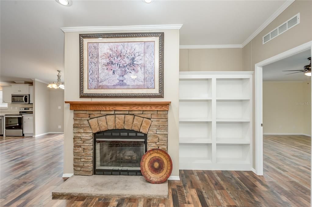 Living room with fireplace and built-in shelves