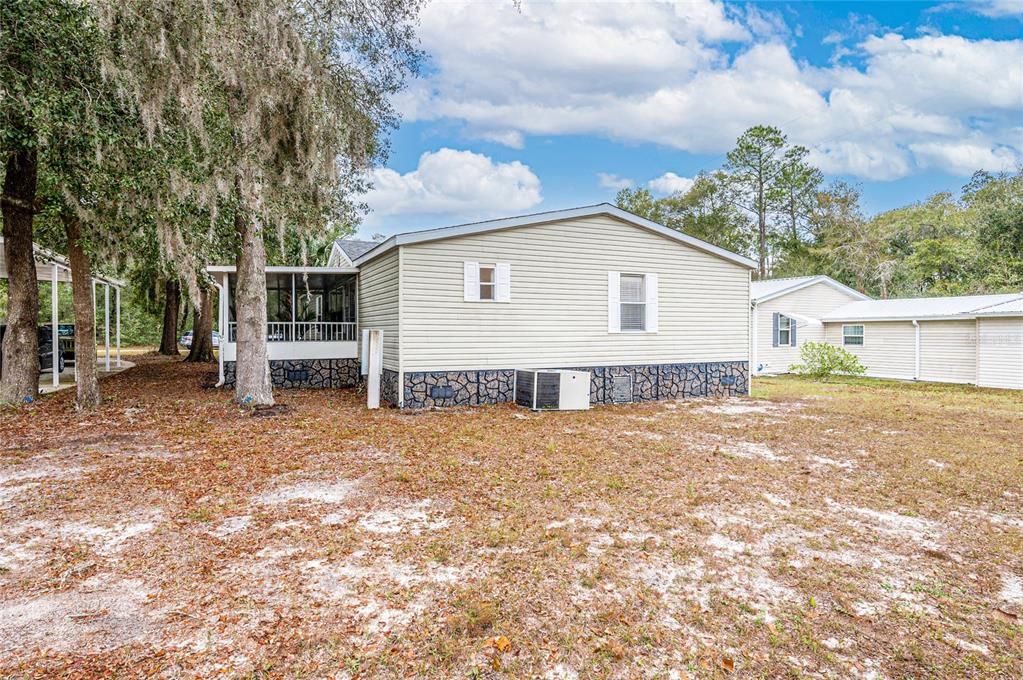 Rear of property showing screened porch off of living room