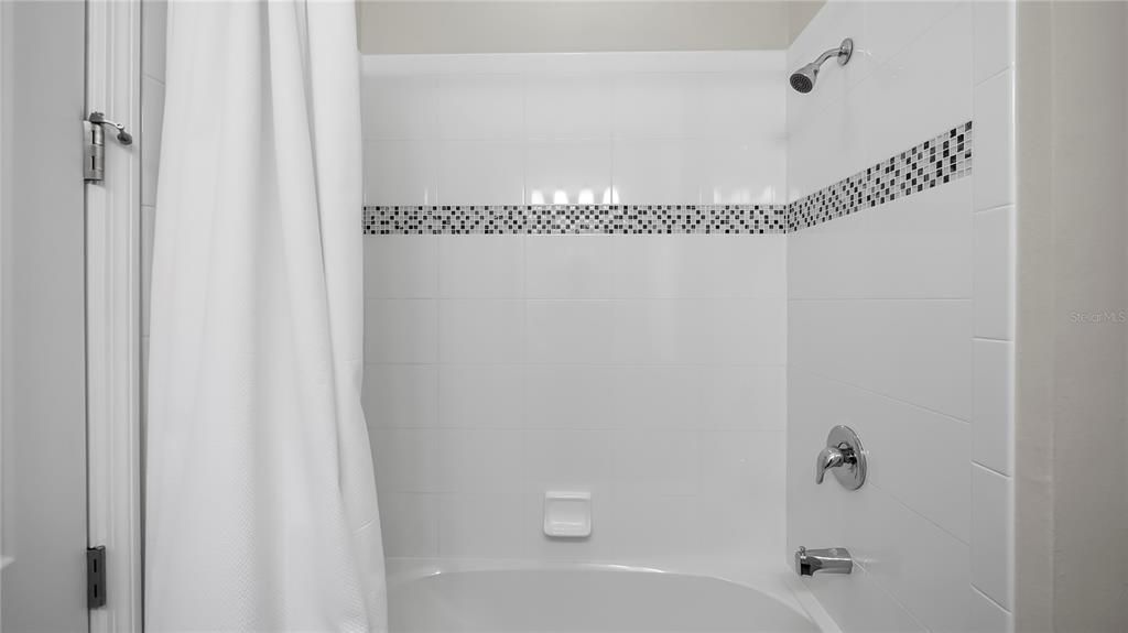 Bathroom 2 tub and shower combo.