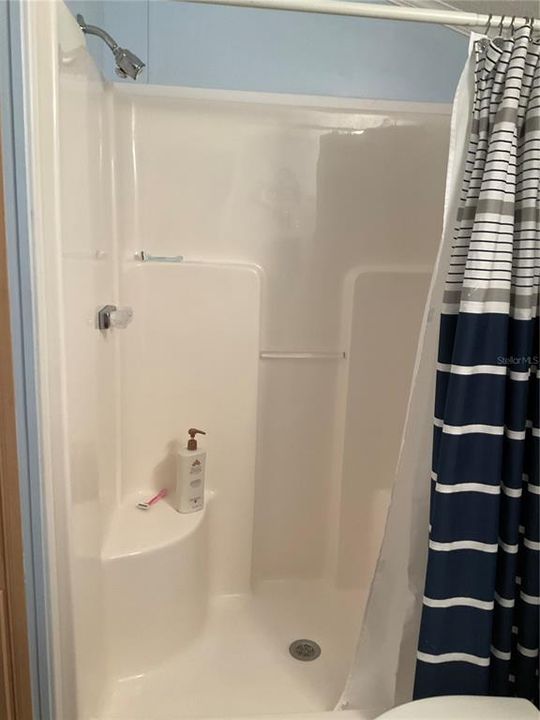 One piece shower with seat