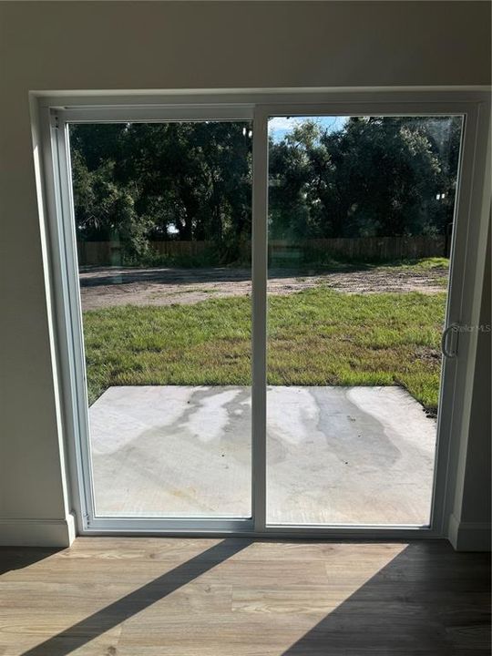 GLASS SLIDER TO BACKYARD PATIO