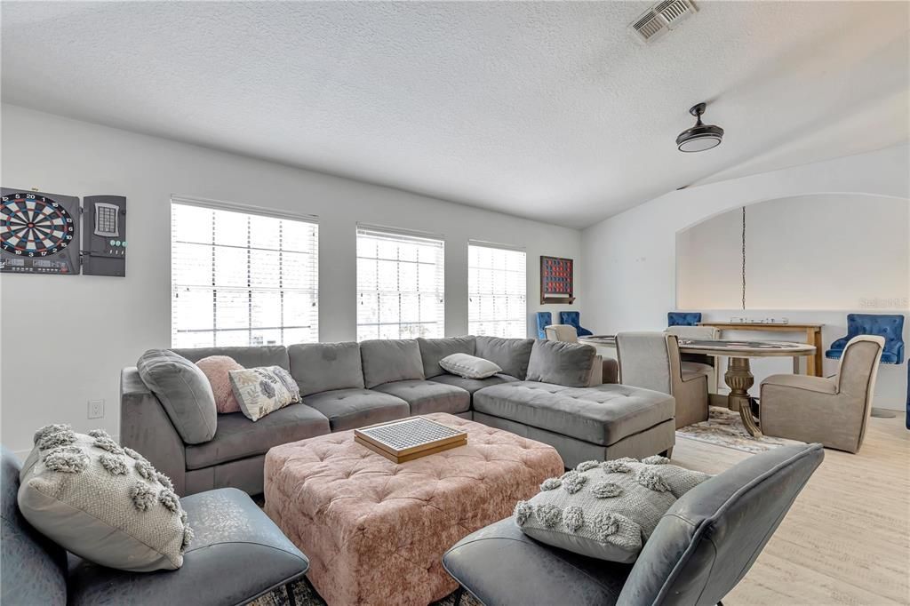 This bonus room is the owners place to enjoy fun times with friends and family. This space is used creatively for them for movies with family, karaoke for the girls and family, darts for the boys and neighbors, and poker for dads night with neighbors.