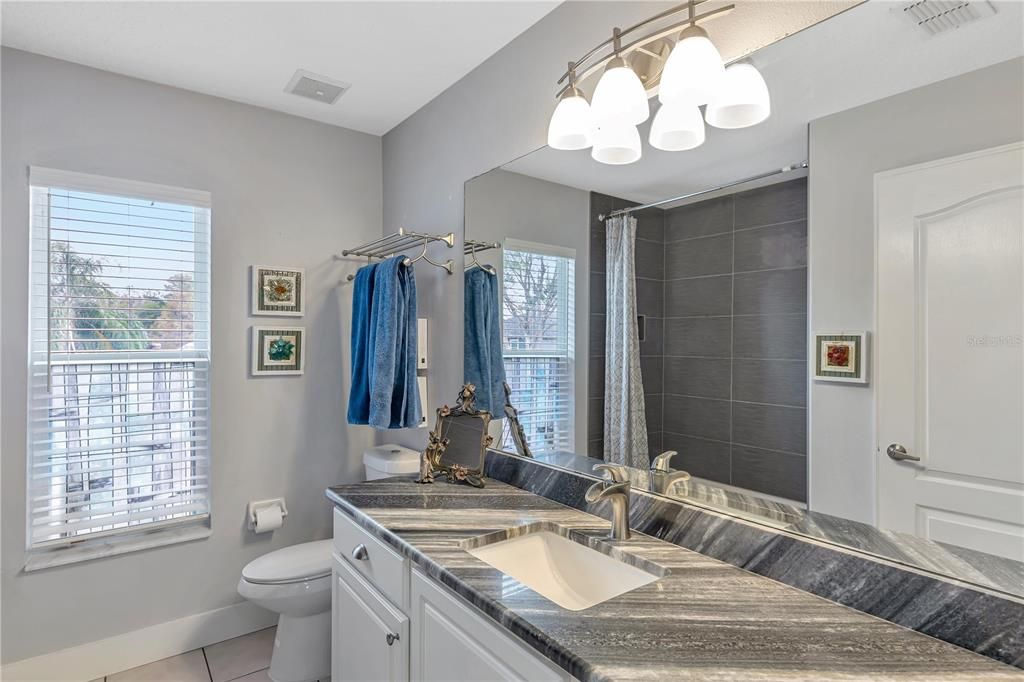 Upstairs granite double sinks and bath and shower combo conveniently located to bedroom 5  and 4.