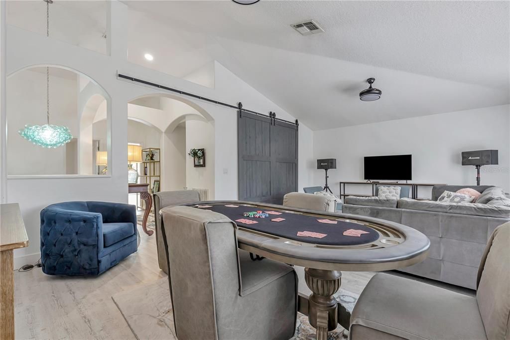 The bonus room is a great space where the past owners used for karaoke and poker and movie night.  They had this custom large door built for privacy or if owner wanted to make a in law suite, add a fridge and microwave and you have a second home with its separate heating and cooling unit.
