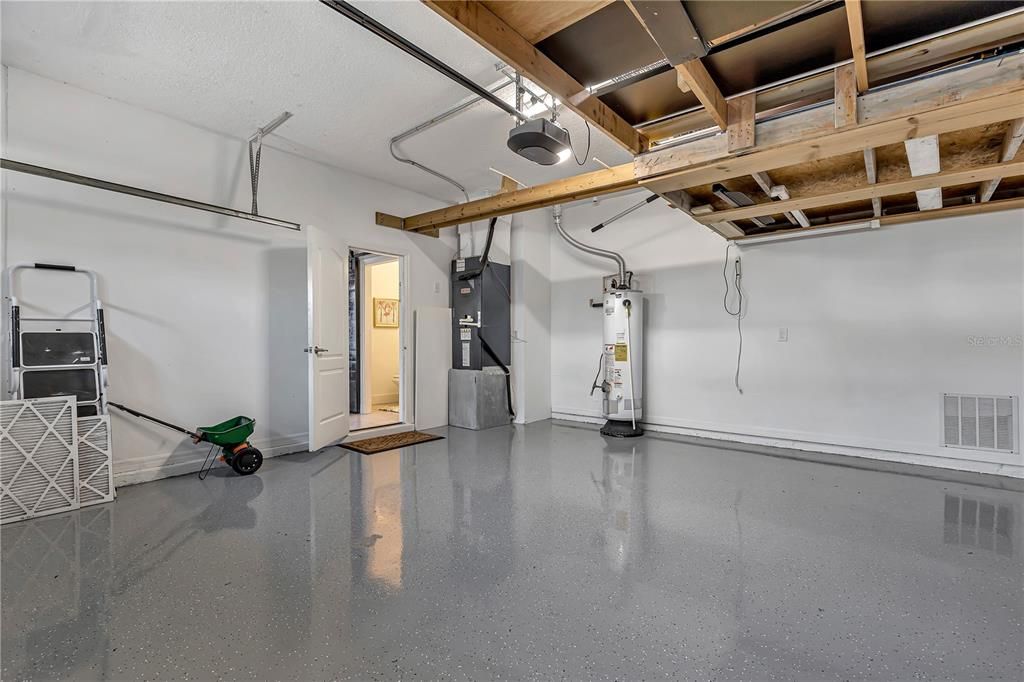 2 car epoxy floor garage, newly painted with storage above.