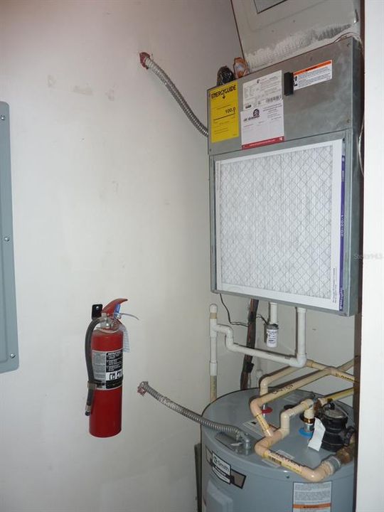 A/C and water heater in utility closet