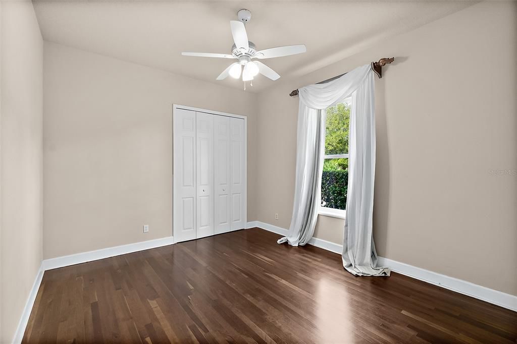 Bedroom 2 w/Wood Floors & Ceiling Fan