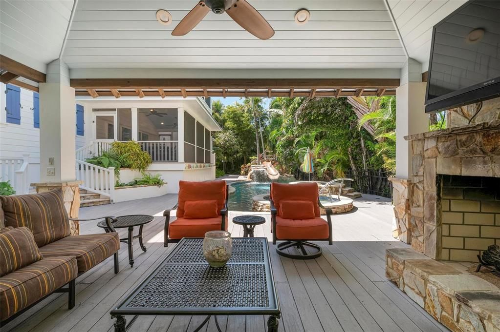 Outdoor pool cabana with outdoor gas fireplace