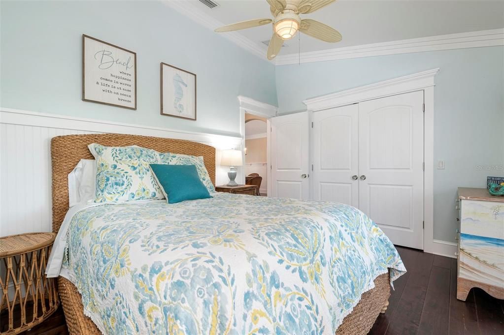 Bedroom 4 with ensuite bath and sliders to screened porch