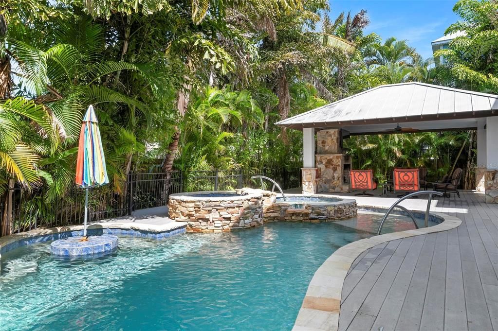 Heated pool and spa with outdoor cabana with gas fireplace