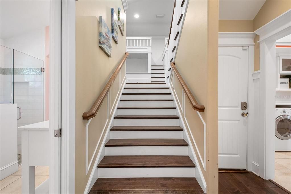 Stairway to upper level, 5 bedrooms, theater and game room