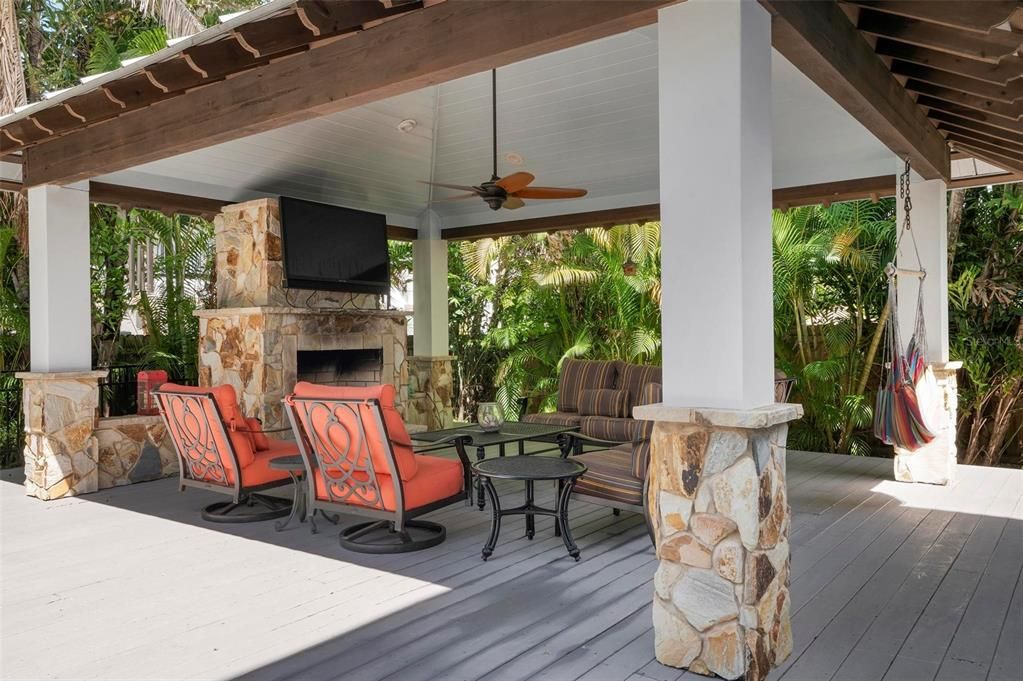 Outdoor pool cabana with outdoor gas fireplace