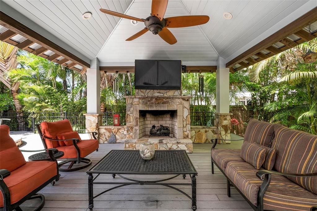 Outdoor pool cabana with outdoor gas fireplace