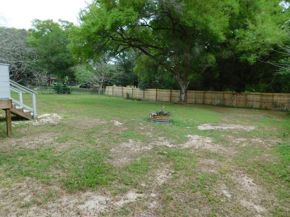 View of yard from the front right corner by the well house