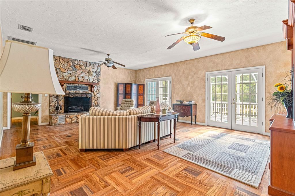 Large Family Room leading out to enclosed pool.