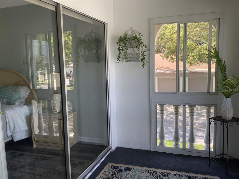 Entry to master bedroom with large 8’ wide sliding doors allow Florida breezes to flow through!