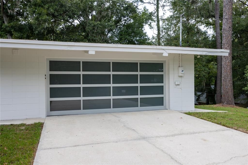 Upgraded glass panel garage door with space for two vehicles