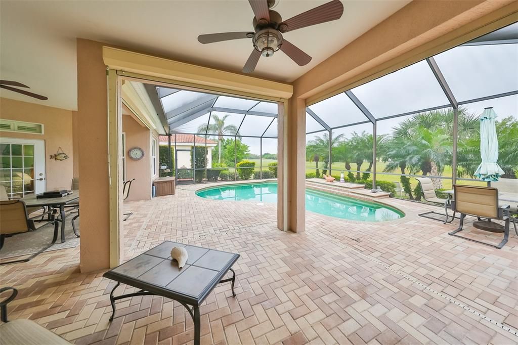 Screened in Lanai w/ Saltwater, heated Pool have custom matching nautical fans with lighting.